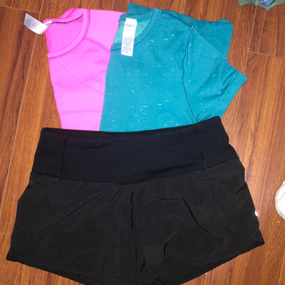 LULULEMON SHORTs AND 2 IVIVVA TOPS